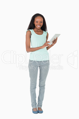 Woman using tablet computer on white background