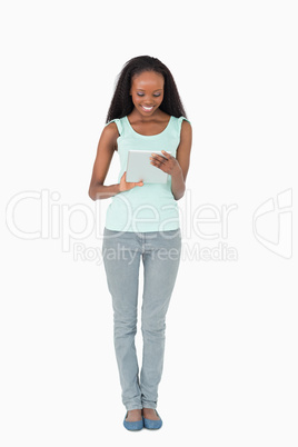 Woman working on tablet on white background