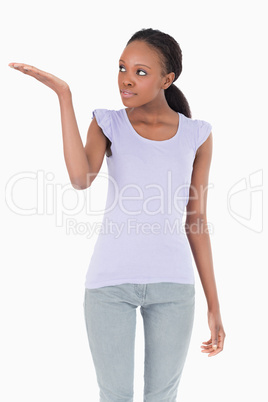 Close up of woman presenting something on white background