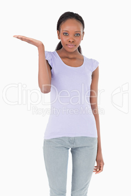 Close up of woman holding something up on white background