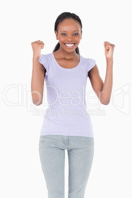 Close up of woman celebrating success on white background