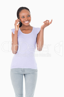 Close up of woman talking on the phone on white background