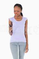 Close up of woman texting on white background
