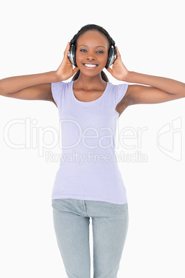 Close up of woman enjoying music on white background