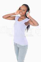 Close up of woman with headphones on white background