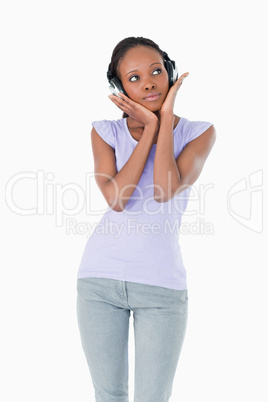 Close up of woman enjoying music with headphones on white backgr