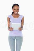 Close up of woman holding tablet on white background