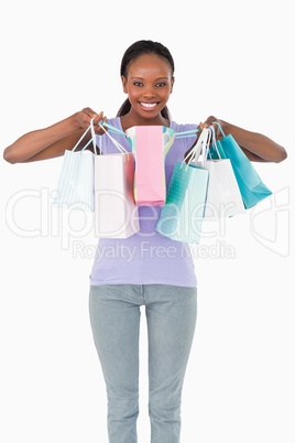 Close up of woman with her shopping on white background