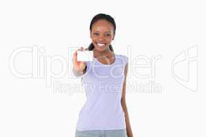 Smiling woman presenting business card on white background