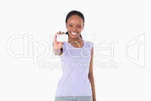 Woman presenting business card on white background