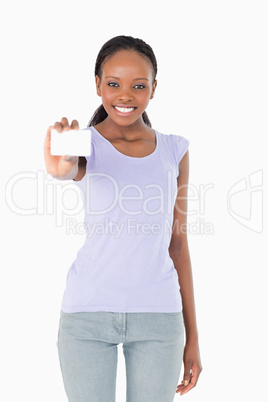 Woman presenting her business card on white background