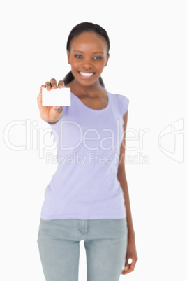 Business card being presented by woman on white background