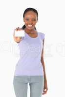 Business card being presented by woman on white background