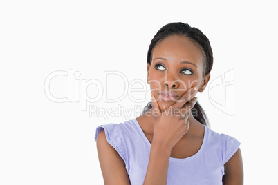 Close up of woman thinking about something on a white background