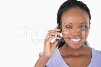 Close up of young woman on the phone on white background Close up of young woman on the phone on white background
