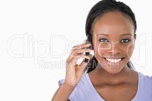 Close up of young woman on the phone on white background