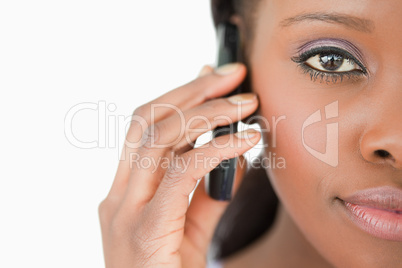Close up of woman on the cellphone on white background