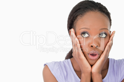 Close up of woman being afraid against a white background