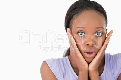 Close up of frightened woman on white background