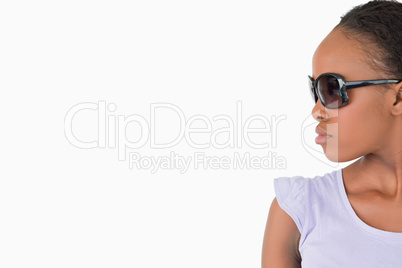 Close up of woman with sunglasses on white background