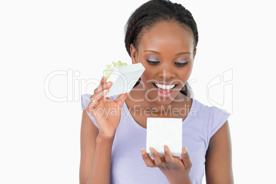 Close up of woman being happy about what is in her present again