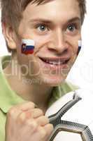 Young Male Football Fan With Slovakian Flag Painted On Face