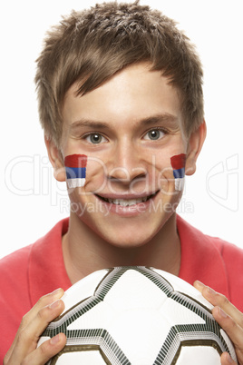 Young Male Football Fan With Serbian Flag Painted On Face