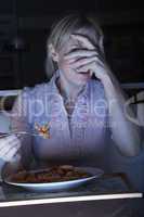 Frightened Woman Enjoying Meal Whilst Watching TV