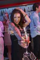 Young Woman Having Fun In Busy Bar