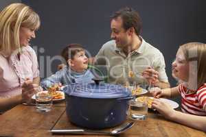 Family Enjoying Meal Together At Home