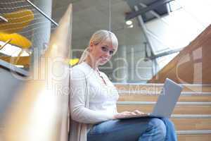 young blond woman with laptop