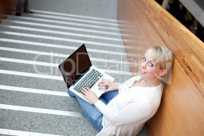 young blond woman with laptop