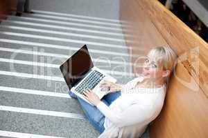 young blond woman with laptop