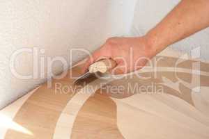 craftsman processes wood surface