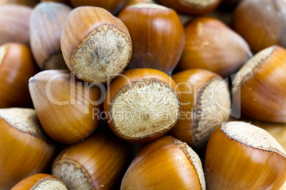 Composition from nuts on the wooden background