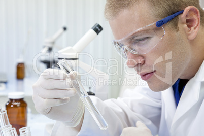 Male Scientist or Doctor With Test Tube In Laboratory