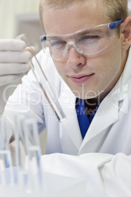 Male Scientist or Doctor With Test Tube In Laboratory