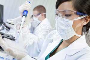 Chinese Female Woman Scientist Using Pipette In Laboratory