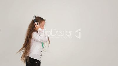 Little girl dancing with headphones