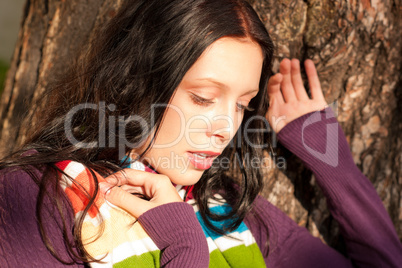 Winter young woman in romantic sunset scenery