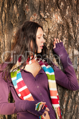 Winter young woman in romantic sunset scenery