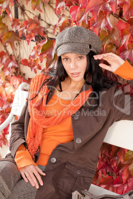 Autumn fashion portrait young woman relax bench