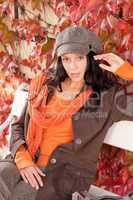 Autumn fashion portrait young woman relax bench