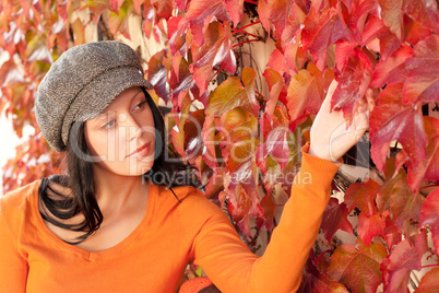 Autumn park bench young woman touch leaf