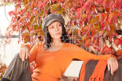 Autumn park bench young woman relaxing