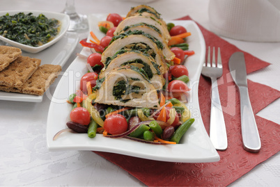 Chicken roulade with spinach and mushrooms with vegetables