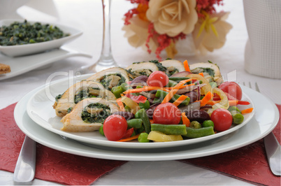 Chicken roulade with spinach and mushrooms with vegetables