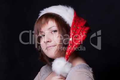 young woman in christmas cap