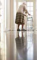 Elderly Senior Woman Using Walking Frame