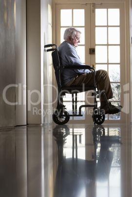 Disabled Senior Man Sitting In Wheelchair